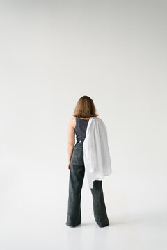 Woman Standing Back To Camera White Background Studio