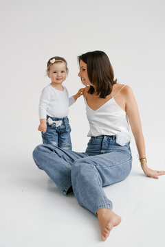 Mother and Toddler Daughter Sitting on Floor