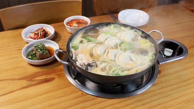 Dumpling hot pot simmering on dining table