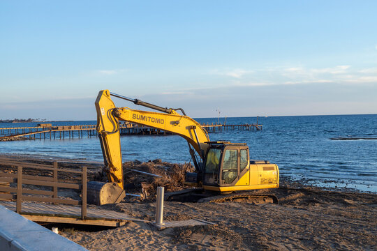 Side, Turkey - March 11 2026: A Sumitomo excavator performing beach restoration and maintenance works on the Mediterranean coast in Side to prepare the resort for the upcoming holiday season.