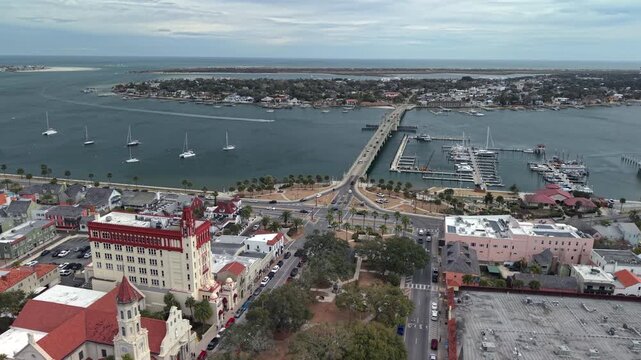 Aerial view of the Bridge of Lions spanning the Matanzas River with the historic district and sailboats in St. Augustine, Florida, United States.