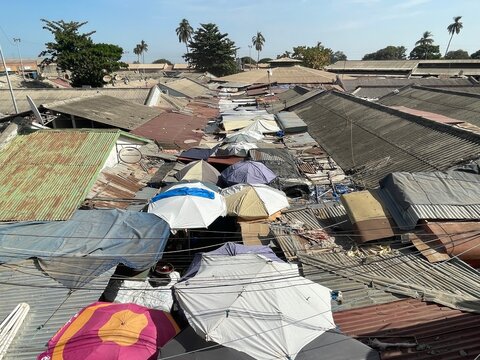 Corrugated iron roofs and umbrellas of Royal Albert Market in Banjul, The Gambia