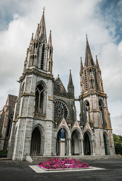 Forecourt of the Basilica with a sculpture of Virgin Mary in Pontmain, Mayenne department - France