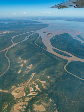 Charter flight view of river flowing into the sea near Madagascar