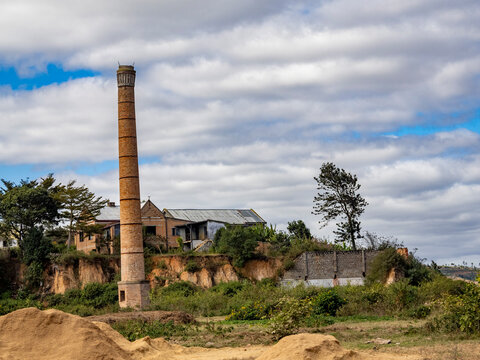 Scenes from the road showing a chimney and buildings along a highway in Madagascar