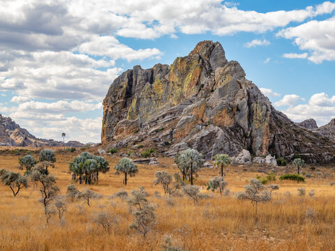 Sandstone formations rise sharply in the landscape of Isalo Massif with detailed textures and colors in Madagascar skies