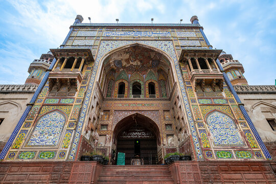 Wazir Khan Mosque shows intricate tile work and architectural features in Lahore Pakistan during the day