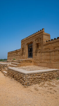 Explore the historical architecture of Makli Necropole in Thatta, Pakistan with ancient tombs and stones on a bright day
