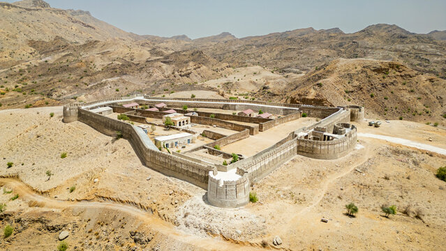 Historic Ranikot Fort stands amidst the dry landscape of Sindh, Pakistan, showcasing its ancient architecture and rugged surroundings