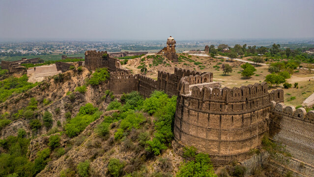 Explore the historical Rohtas Fort in Punjab, features stone walls and ancient architecture under a clear sky