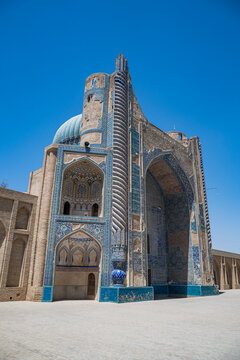 Exploring the architecture of the Green Mosque in Balkh, Afghanistan under clear blue skies