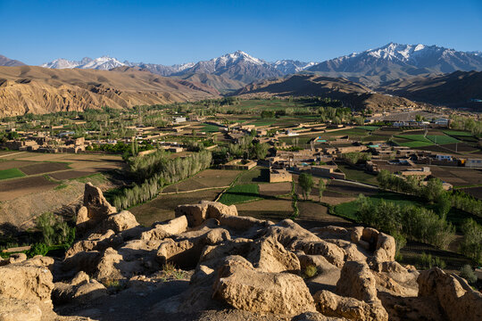 View of mountains and fields from the overlook at Shahr-e-Gholghola in Bamyian, Afghanistan during daylight hours