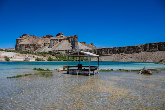 View of multi coloured lake with a gazebo in Band-e-Amir National Park, showcasing the unique landscape of Afghanistan