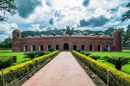 Exploring Sixty Dome Mosque, a UNESCO site located in Bhagerat, Bangladesh with historical architecture and beautiful surroundings
