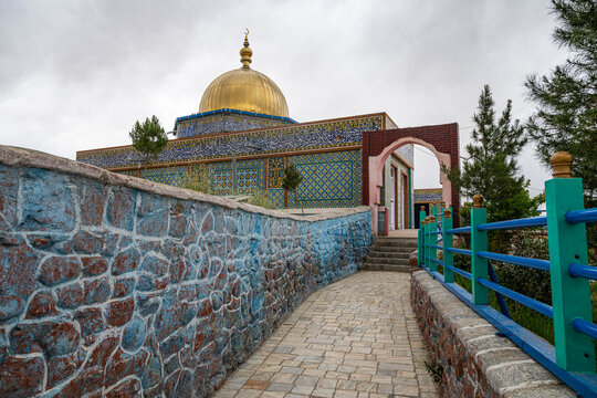 Mausoleum of Hakim Sanai shows unique architecture and colorful design in Ghazni Afghanistan near a stone pathway