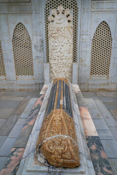 Baburs tomb is located in the historical Gardens of Babur in Kabul, Afghanistan with intricate stone work and inscriptions