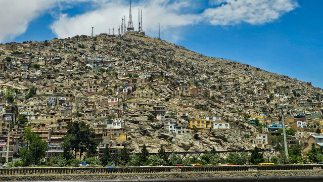 Hills with buildings and telecommunications towers in Kabul, Afghanistan during daytime