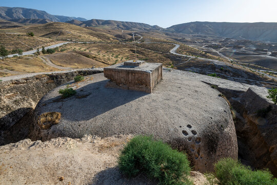 Carved giant stupa in rock located in Samangan region of Afghanistan amidst hills and valleys
