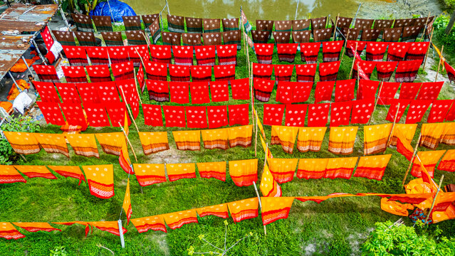 Freshly dyed cloths hanging under the sun in a village in Bangladesh