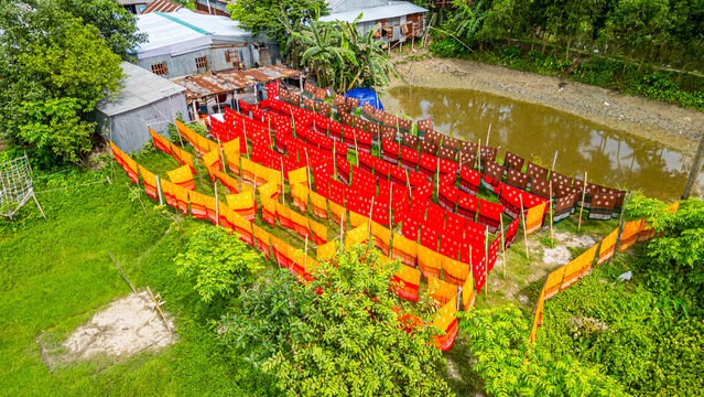 Freshly dyed cloths drying outside in Araihazar village of Bangladesh during the day under the sun