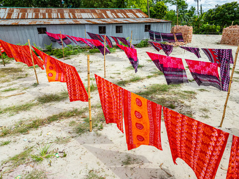 Freshly dyed cloths hang to dry under the sun in Araihazar village in Bangladesh