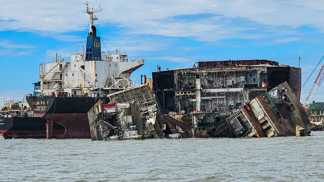 Shipwrecks remain on the shore in Chittagong, Bangladesh, showcasing the history of maritime industry and decay
