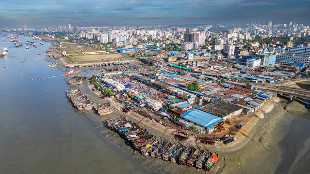 Boats anchor on Karnaphuli River near fish market in Chittagong Bangladesh