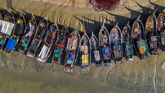 Boats anchored on Karnaphuli River for fish trading in Chittagong, Bangladesh