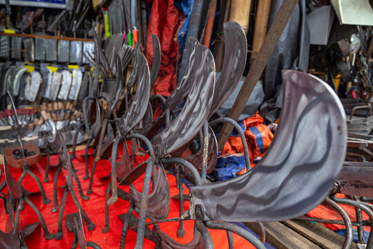 Machetes for sale displayed in Karan Bazar market in Dhaka, Bangladesh where customers explore various options