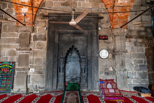 Old mosque structure in Paharpur shows intricate stone carvings and traditional interior design from a historical period in Bangladesh