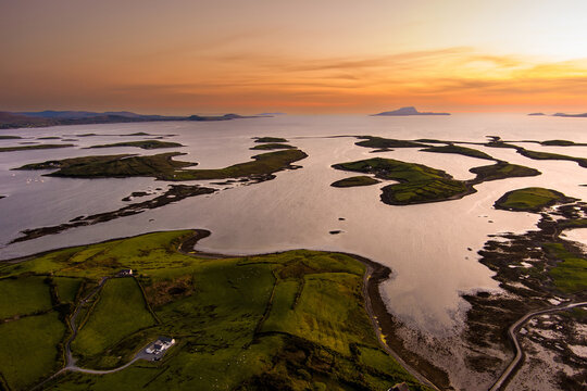 Aerial sunset view over Clew Bay near Westport, County Mayo, Ireland. Scenic Atlantic bay with drumlin islands and mountain silhouettes on the Wild Atlantic Way.