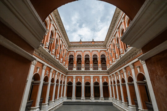Exploring the architecture of historic Sonargaon, Bangladesh with detailed arches and designs in the courtyard