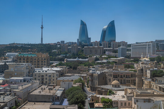 Historic city of Baku showcases modern flame towers against ancient architecture in Azerbaijan