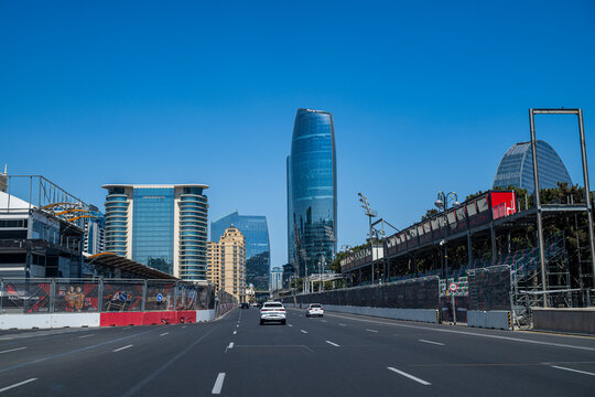 Baku showcases modern architecture and high rise buildings along a clear road on a sunny day