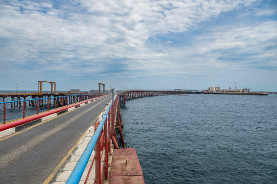 Long road stretching into the ocean near oil city Neft in Azerbaijan