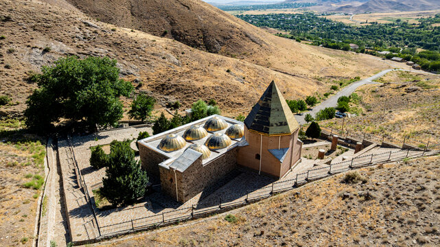 View of Sheikh Khorasan mausoleum surrounded by hills and trees in Nakhchivan Azerbaijan