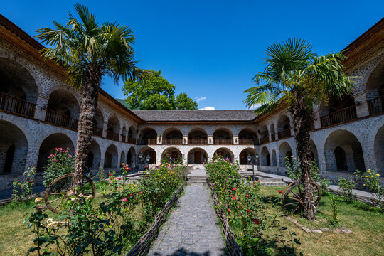 Explore the architecture of Carawanserai in Sheki, Azerbaijan with its historical design and surrounding gardens