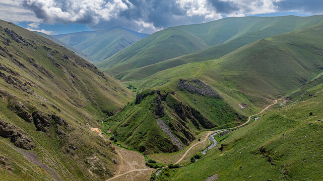 Aerial view reveals scenery around Istisu in Qarabaqh region of Azerbaijan with mountains and valleys present on a clear day