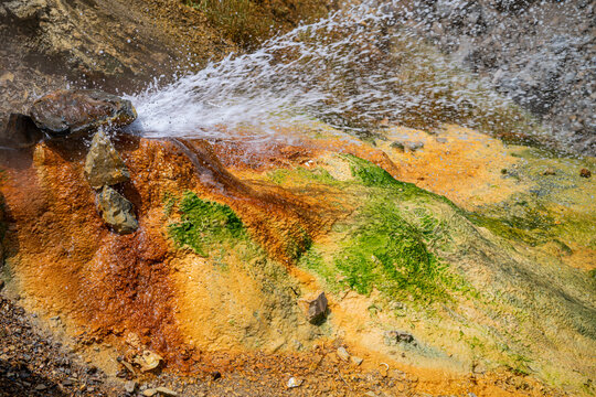 Hot water spring erupts at Istisu in Qarabaqh showing colorful mineral deposits and natural features of the area