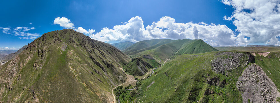 Highland scenery of Qarabaqh showing hills and valleys under a blue sky in Azerbaijan