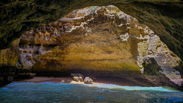 Exploring the seacave along the coast of Carvoeiro in Algarve, Portugal during daylight hours