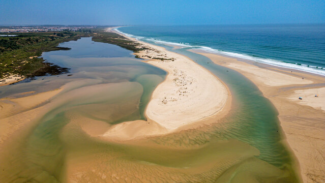 Long sandy beaches and river areas near Cacela Velha in Portugal offer sunshine and space for outdoor activities