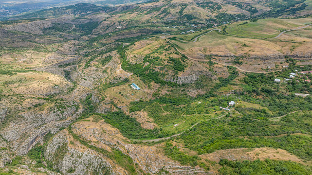 Exploring the vast landscape of a canyon in Qarabaqh with green valleys and rugged terrain in Azerbaijan