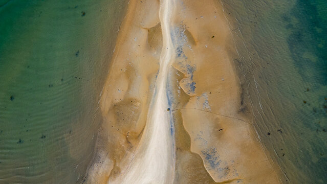 Exploring sandy wetlands near Olhao in Algarve, Portugal with green water and unique shapes