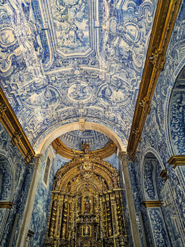 Beautiful blue tiles cover the walls and ceiling of the Church of Sao Lourenco in Portugal, showing detailed artwork and design elements