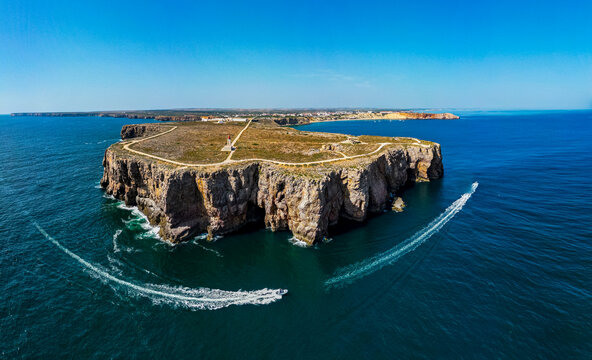 Explore Sagres Fortress and peninsula in Algarve, Portugal with clear blue skies and ocean views
