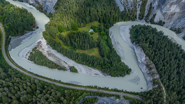 Aerial view shows the winding paths of the Rhein gorge in Switzerland surrounded by trees and land