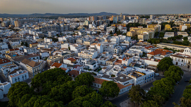 Views of the old city of Faro in Algarve show buildings and streets in a vibrant urban setting during daylight