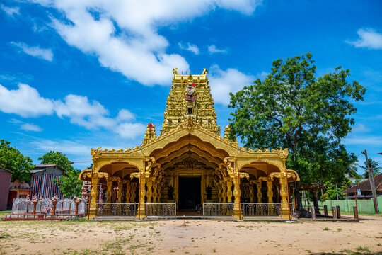 Visitors explore the architecture and grounds of Nallur Kandaswamy Devasthanam Hindu temple in Jaffna, Sri Lanka on a sunny day