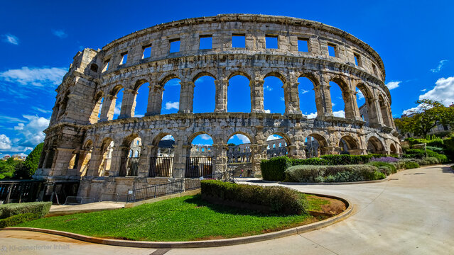 Roman amphitheater in Pula showcases ancient architecture and history during sunny day in Croatia